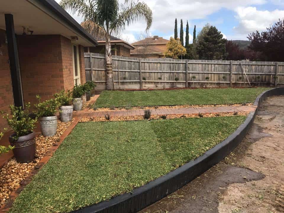 laying turf and concreted driveway and retaining wall, a full landscaping project